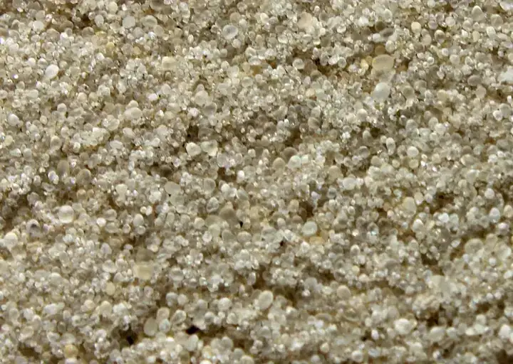 Close-up texture of golf course sand ready for screening